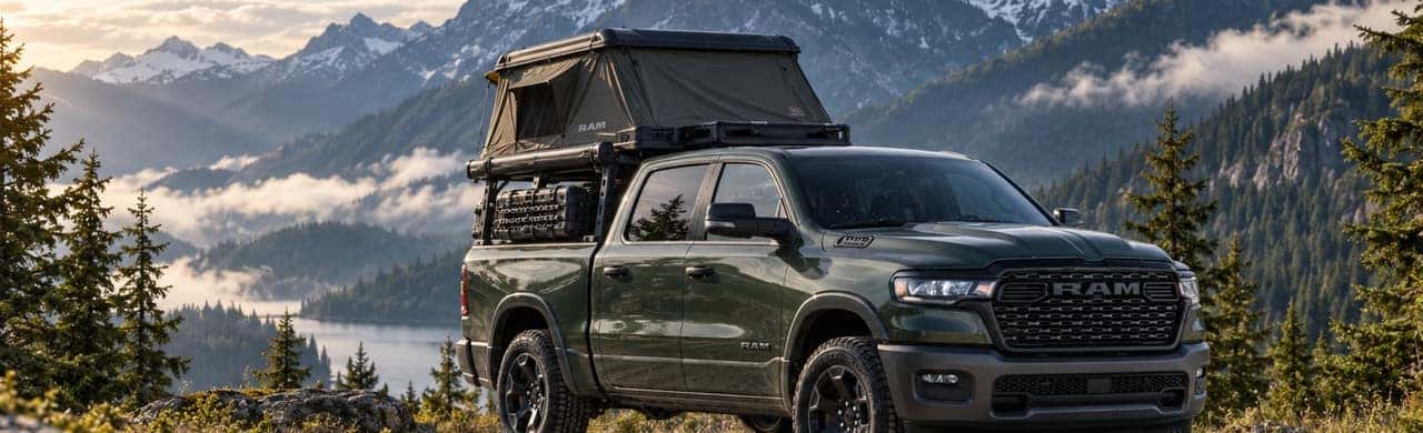 2026 Ram 1500 with bed rack and roof tent in a Pacific Northwest mountain setting