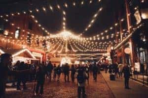 A crowd of people walking around outdoors during Cleveland Winterfest
