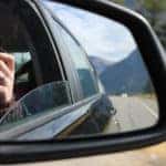 Woman on a Road Trip Taking a Photograph