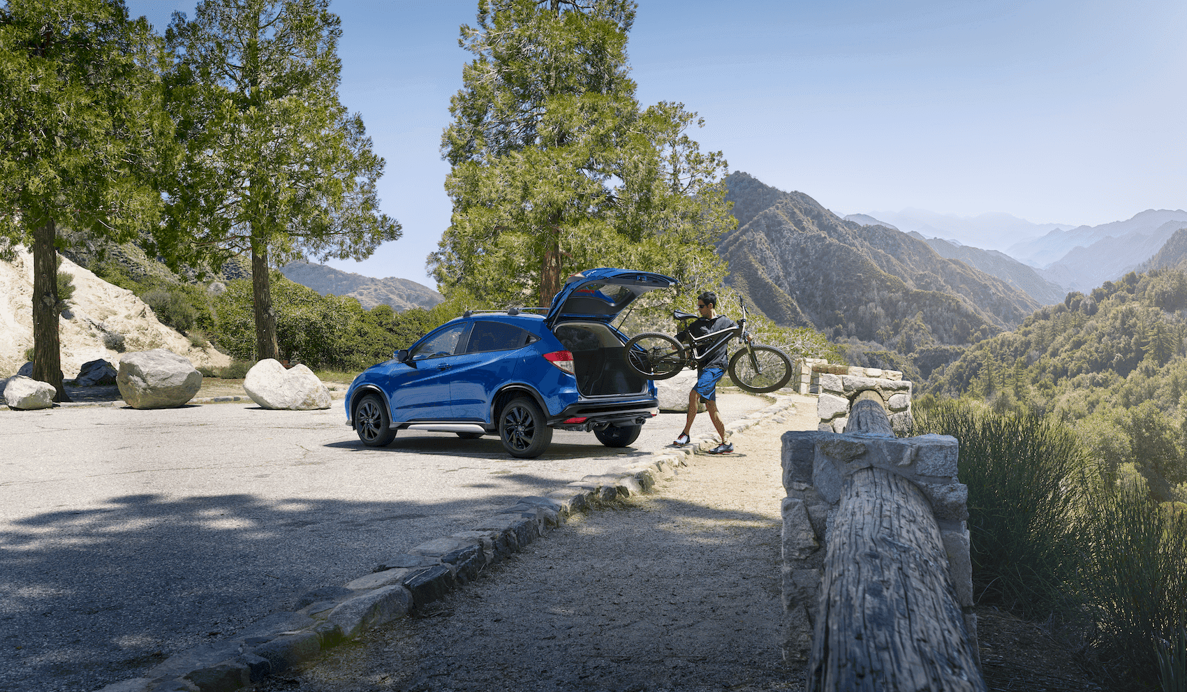 Man placing bicycle in Honda HR-V 