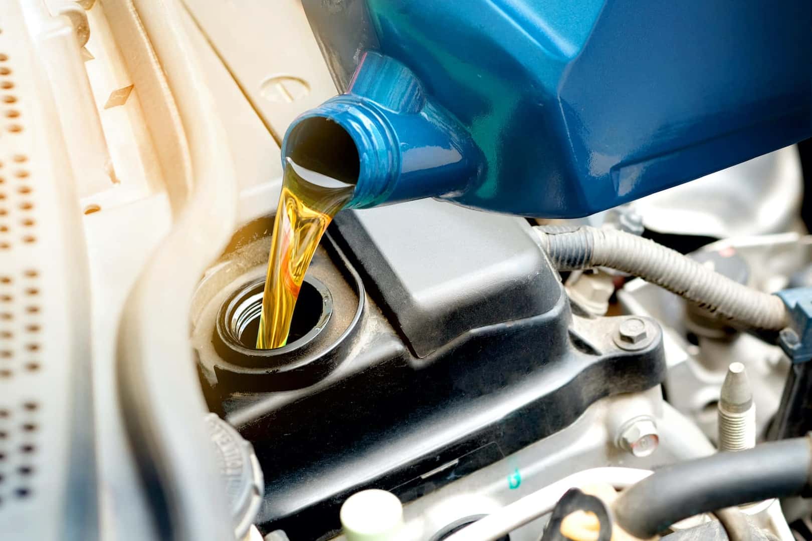 Oil being pouring into car