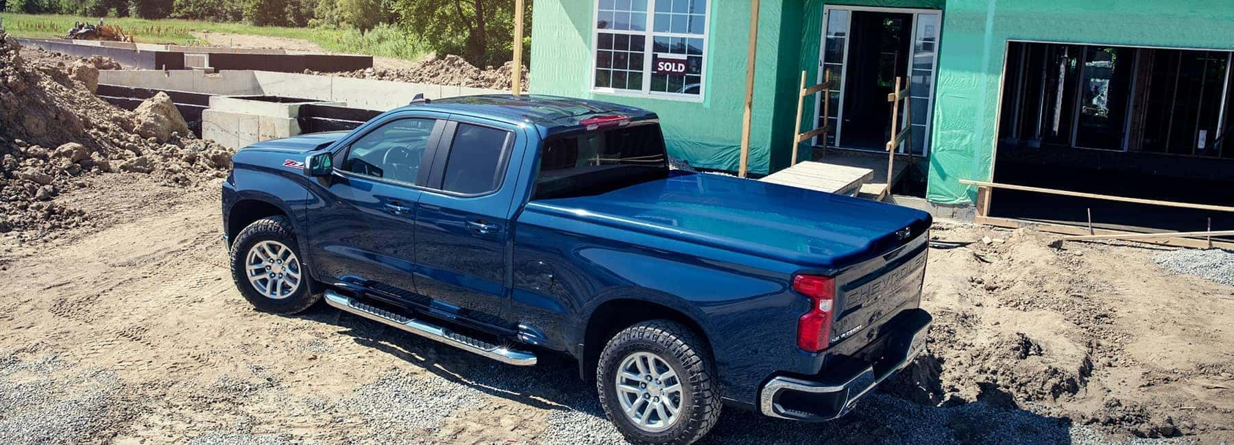 Blue 2021 Chevrolet Silverado 1500LD at a Construction Site