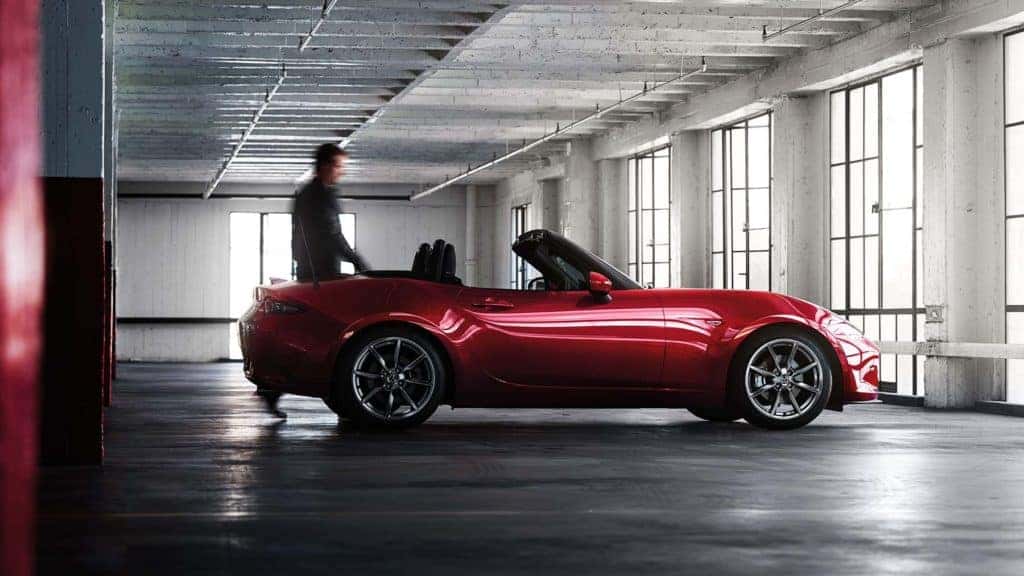 2022 Mazda MX5 Miata red sports car person inside building
