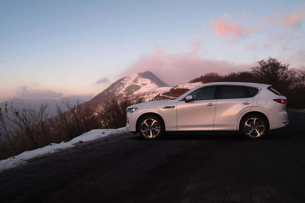 White Mazda CX-60 SUV Outside Mountains Snow