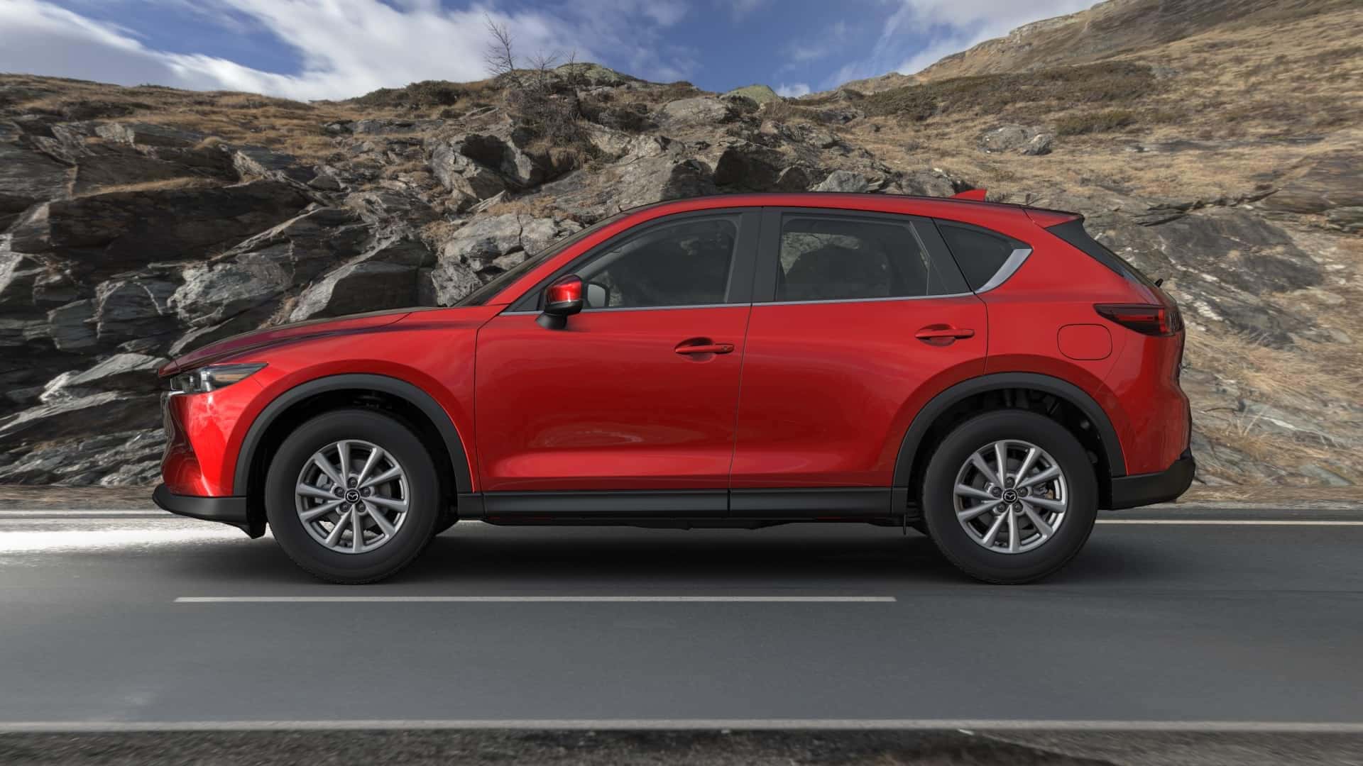 Red Mazda CX5 SUV Outside Brown Rocks 