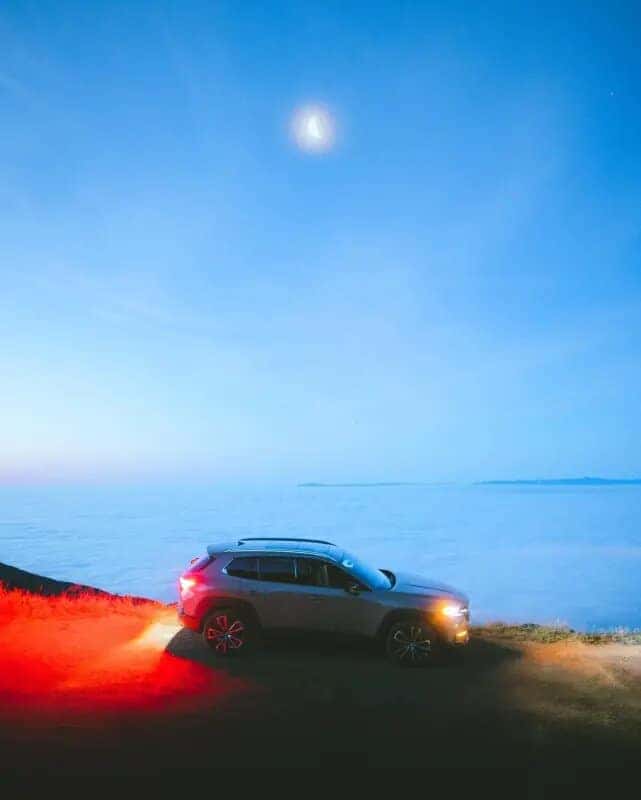 Gray Mazda CX50 SUV Outside Moon Water