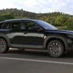 Black Mazda CX-50 SUV Outside Trees Road