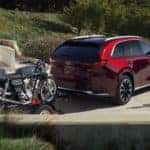 Red Mazda CX-90 SUV Motorcycle Bushes
