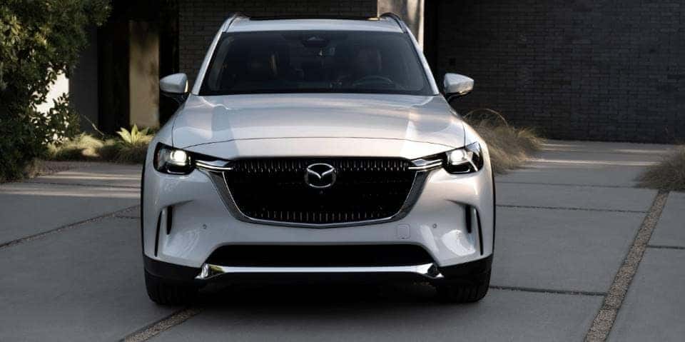 White Mazda CX90 SUV Outside Home
