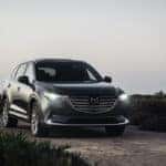 Gray Mazda SUV Sand Grass Ocean