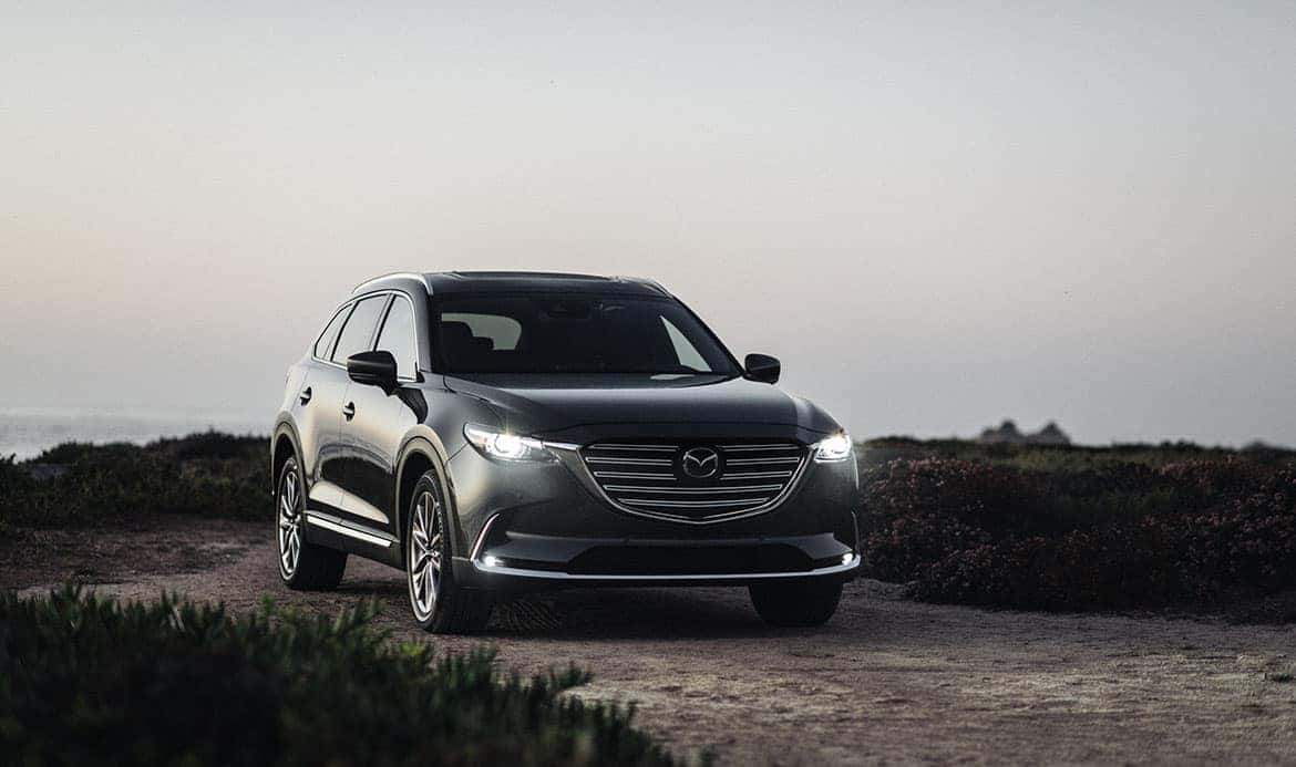 Gray Mazda SUV Sand Grass Ocean