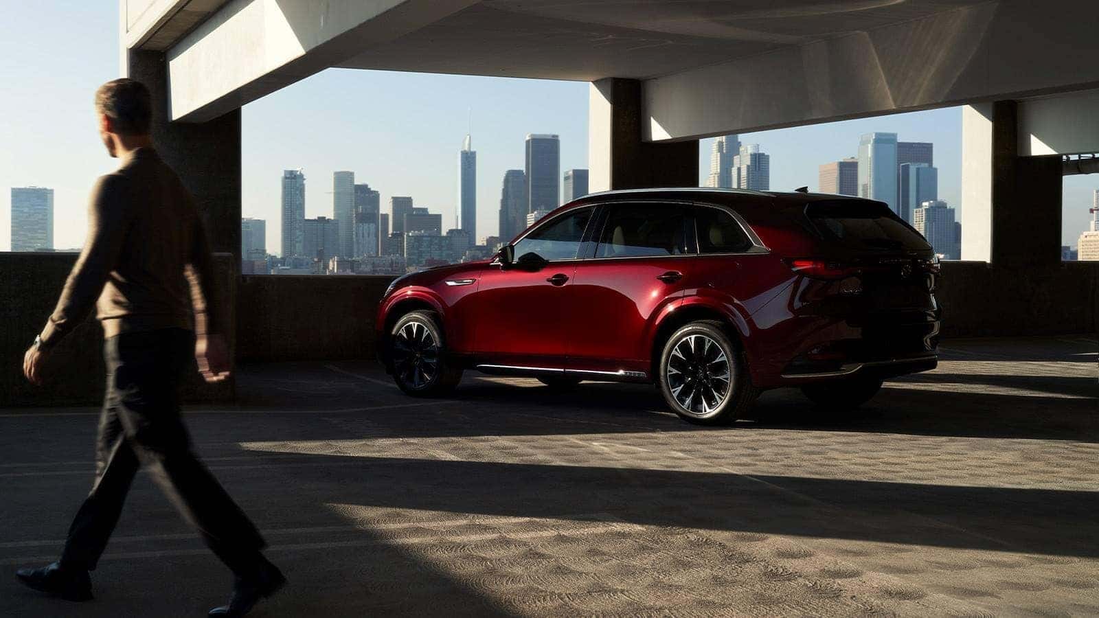 Red Mazda CX-90 SUV Man Garage Buildings