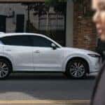 White Mazda CX-5 SUV Woman Man Street