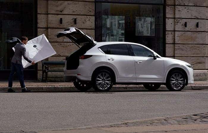 White Mazda CX-5 SUV Man White Box Street Building