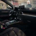 Mazda Vehicle Brown Interior Woman building