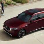 Red Mazda CX-90 SUV People Beige Pavement