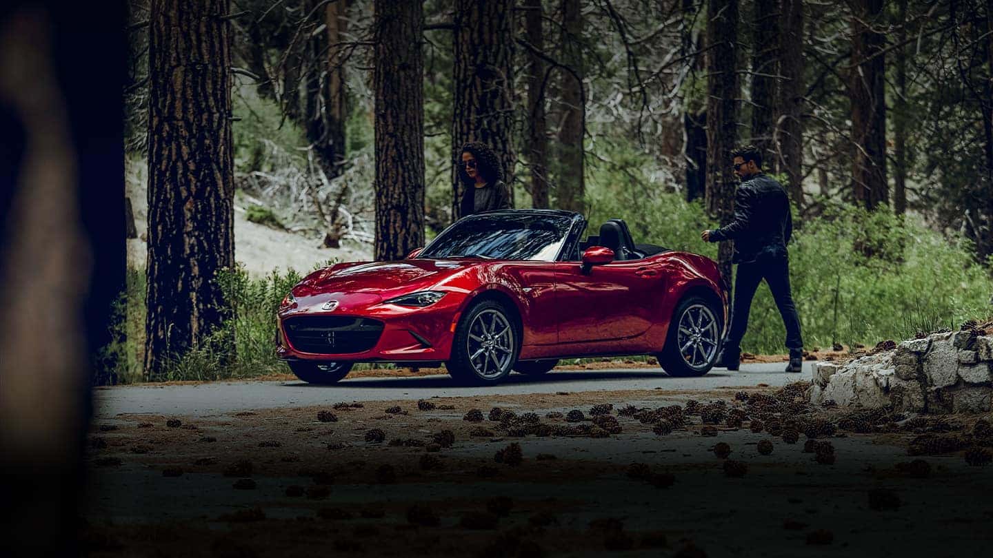 Red Mazda Miata MX-5 Sports Car Two People Woods