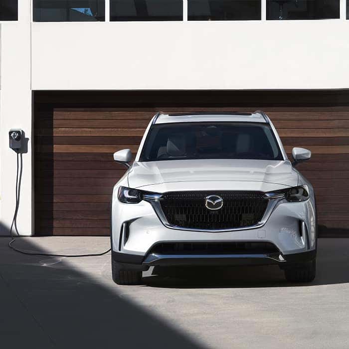 White Mazda CX-90 SUV Brown Garage Door 