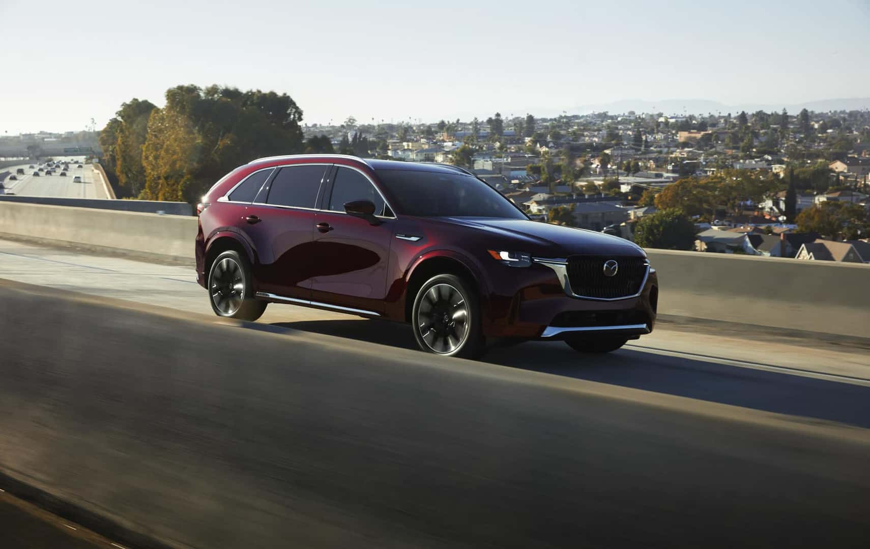 Burgundy 2024 Mazda CX-90 SUV Open Road Houses