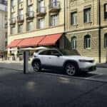 White Mazda MX-30 SUV EV Buildings