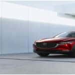 Red Mazda3 Hatchback White Building