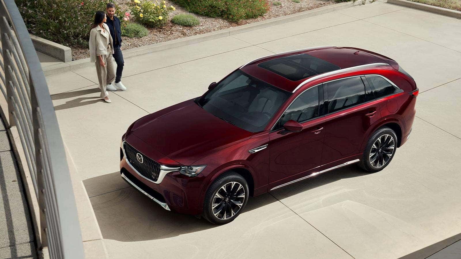 Burgundy Mazda CX-90 SUV People Green Plants