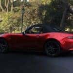 Red Mazda MX-5 Sports Car Trees White Building