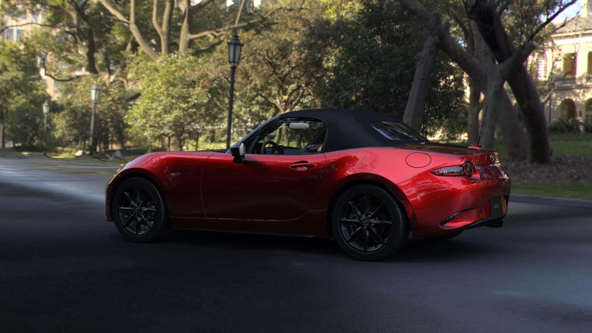 Red Mazda MX-5 Sports Car Trees White Building