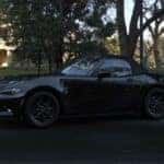 Black Mazda MX-5 Miata Sports Car Trees White House