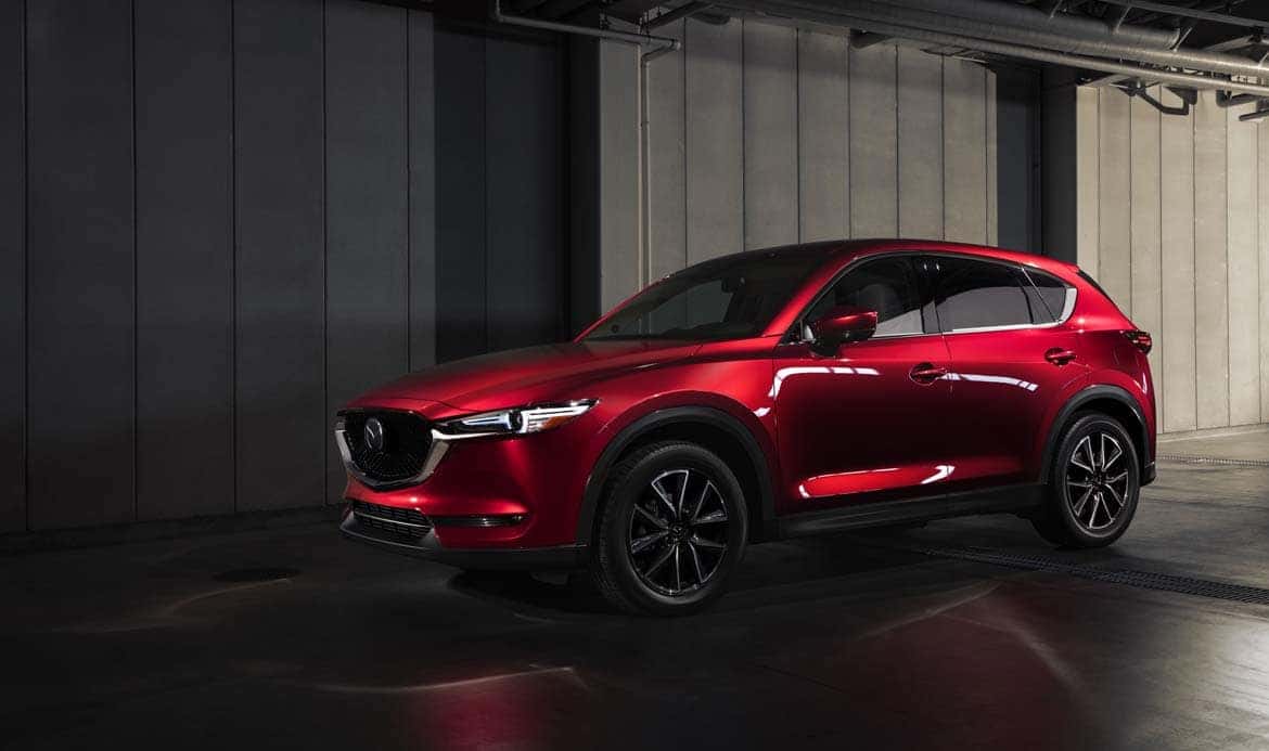 Red Mazda CX-5 SUV Trees