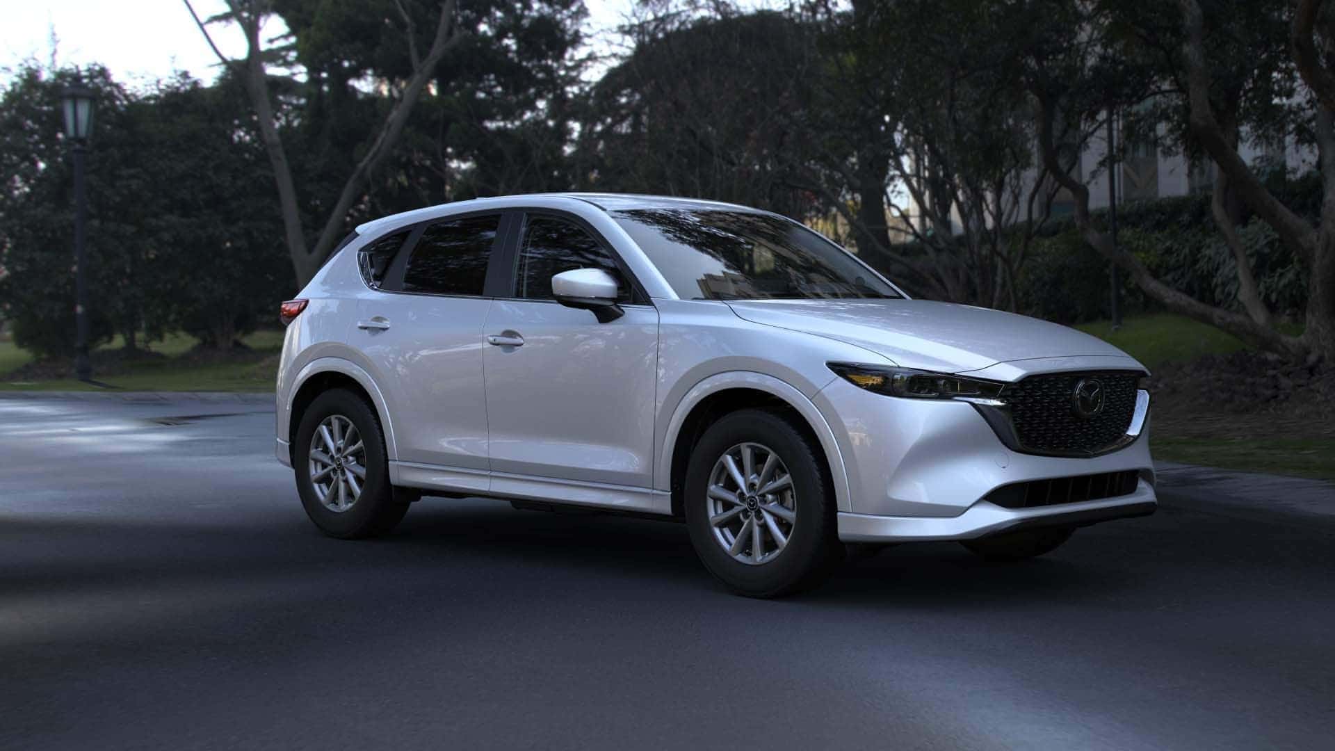 White Mazda CX-5 SUV Green Trees