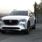 White Mazda CX-90 SUV Gray Road Trees