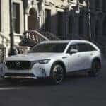 White Mazda CX-70 SUV White Buildings People