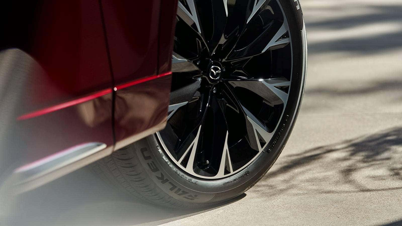 Red Mazda SUV Tire