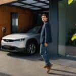 White Mazda MX-30 SUV Man Tree Brown Wall
