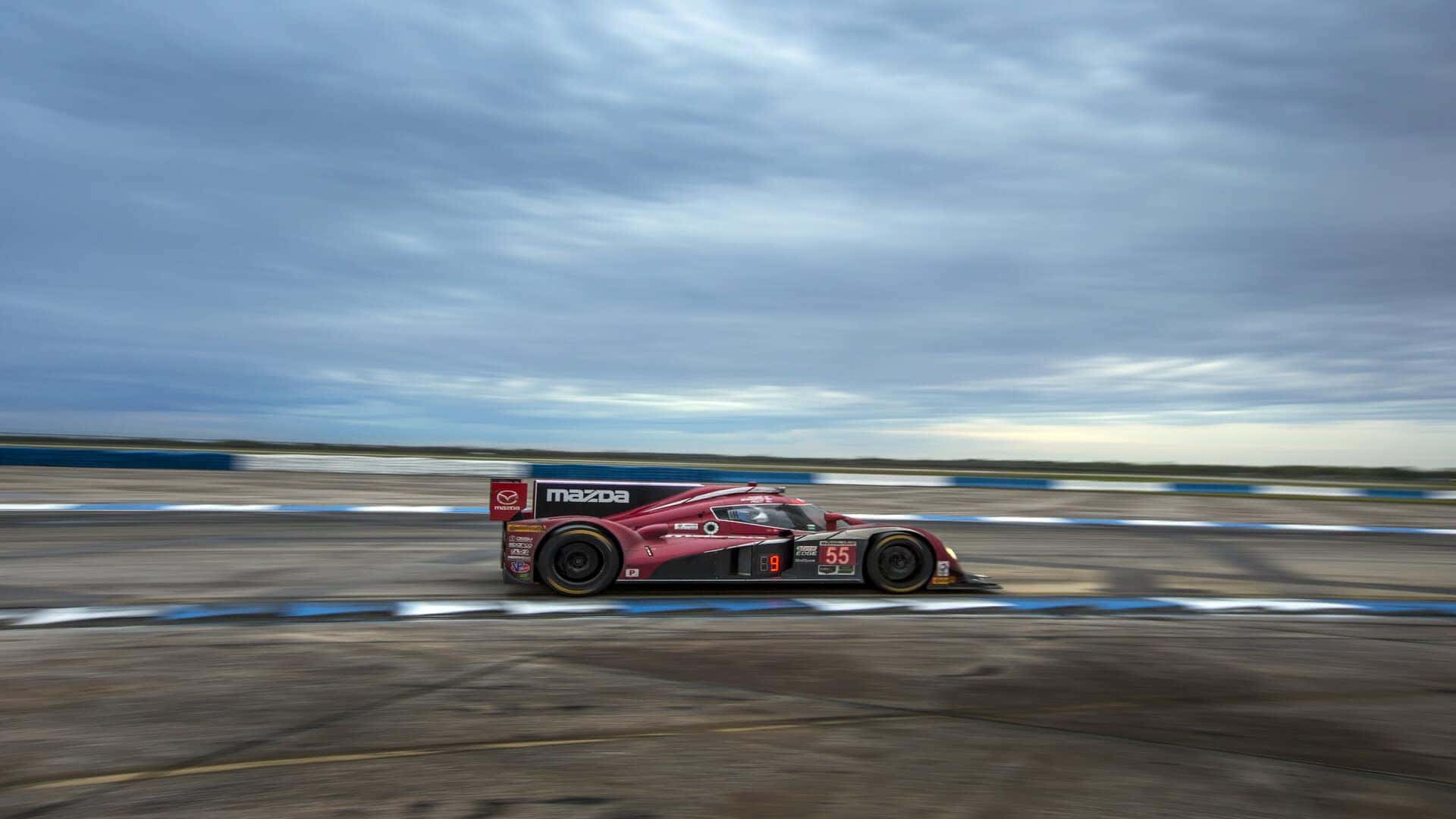 Red Mazda Heritage Collection Race Car Race Track Blue Sky