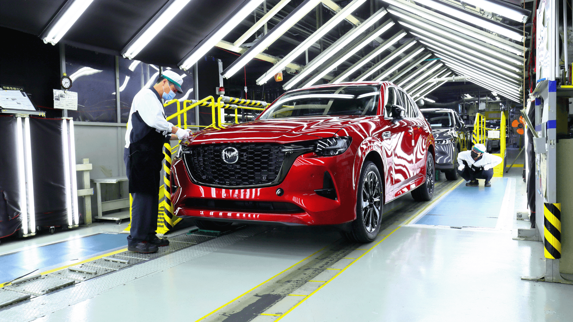 Red Mazda SUV Factory Workers