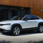 White Mazda MX-30 EV SUV Brown Wall