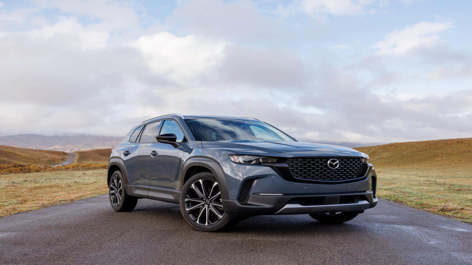 Blue Mazda CX-50 SUV Sky Green Grass