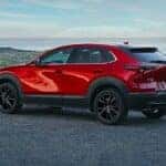 Red Mazda CX30 SUV Rocks Water