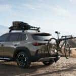 Green Mazda CX-50 SUV Bike People Mountains Bike Rack