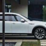 White Mazda CX-90 SUV Two People