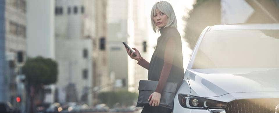 BLonde Person White Mazda CX5