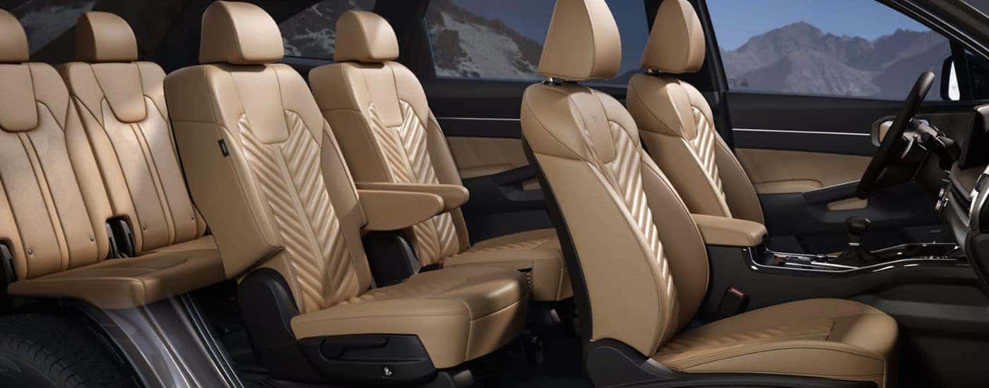 2026 Kia Sorento tan interior showing three rows.