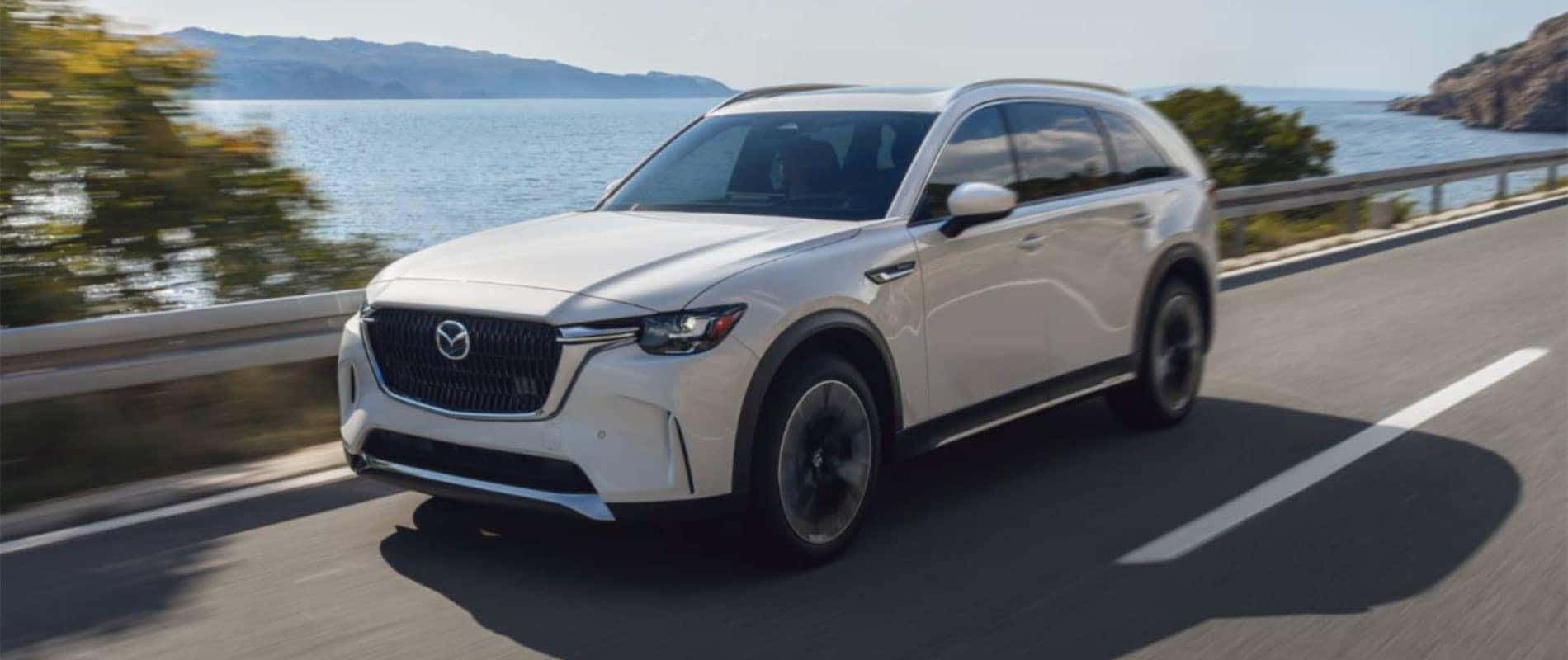 Mazda driving along the ocean