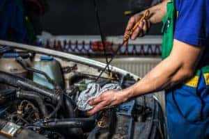 Checking Synthetic Motor Oil with Dipstick