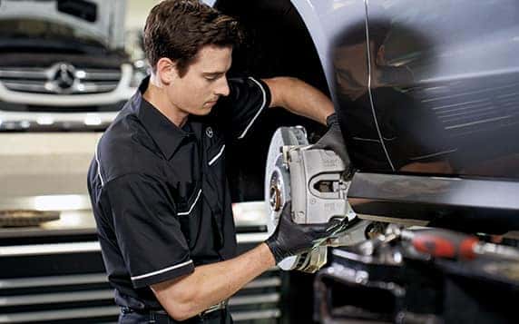 Mercedes-Benz Service Tech Fixing Brakes