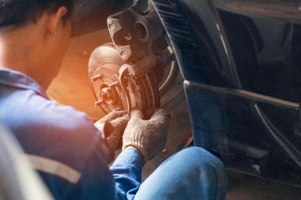 Technician repairing the brakes