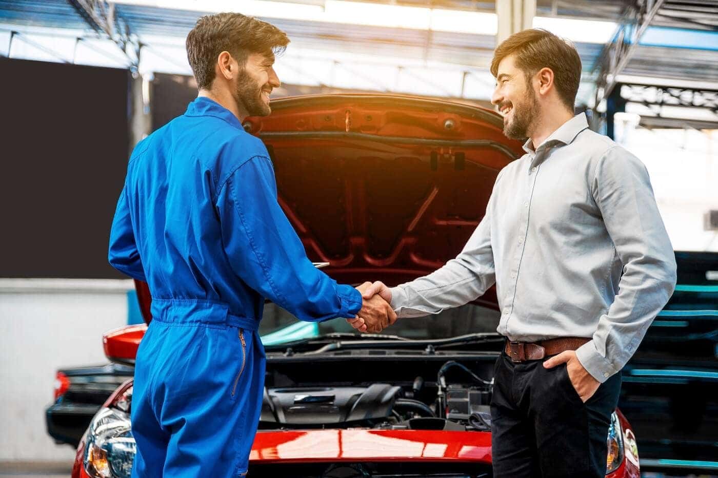 Shaking auto technician's hand