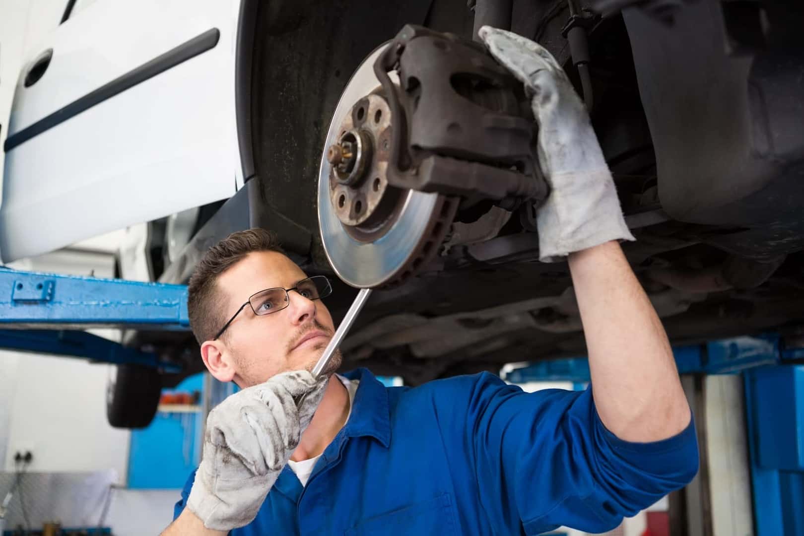 Technician Working on Brakes